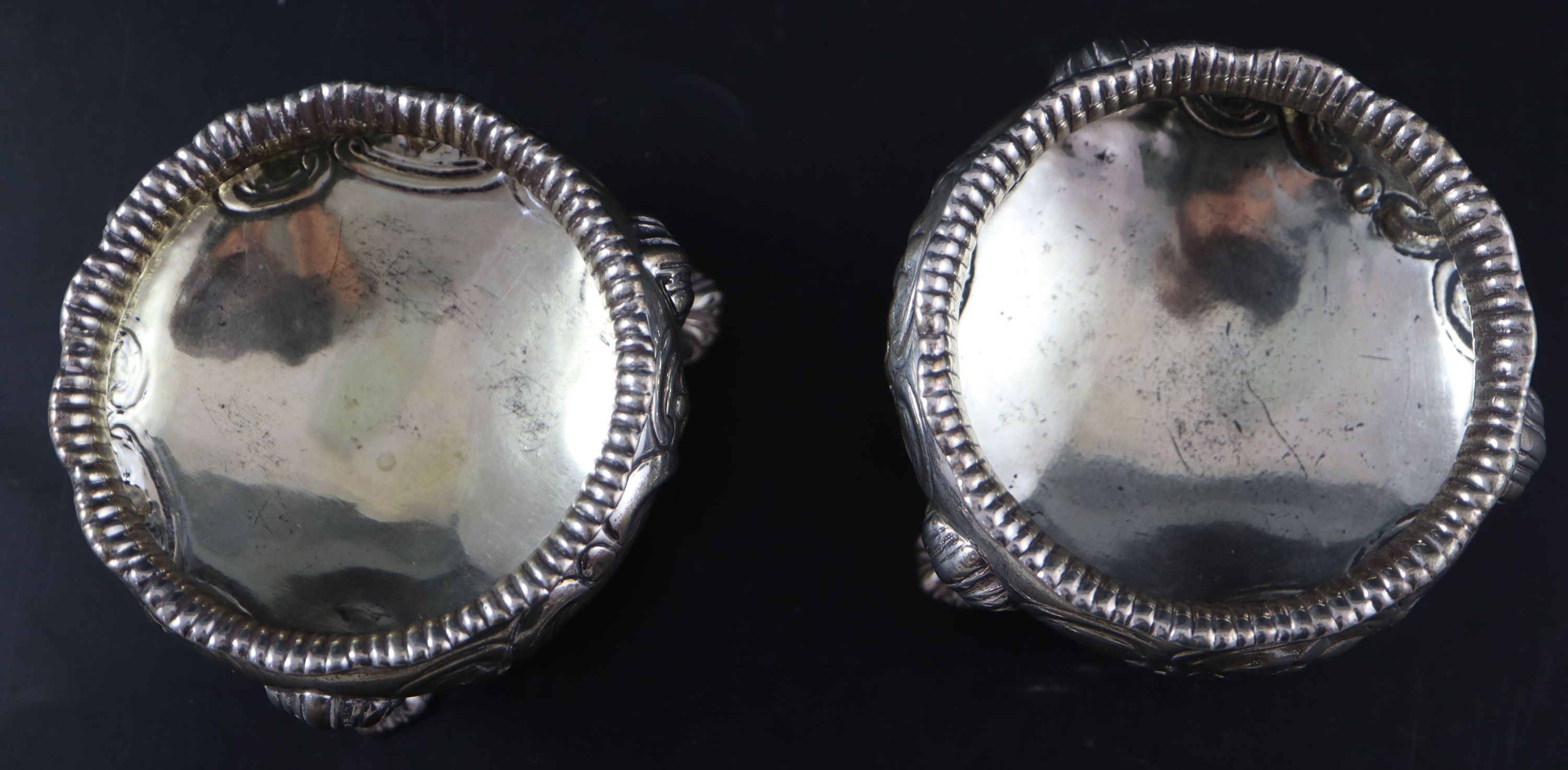 A pair of Victorian embossed silver bun salts, 8.5oz.